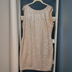 Gold sequence midi dress fits  size 8-10 really well.  There's stretch